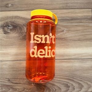 Orange Chick-fil-A Water Bottle with Yellow Lid. “Isn’t life delicious”